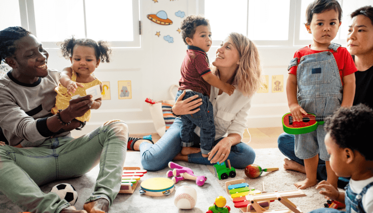 Group of parents and their toddlers in class