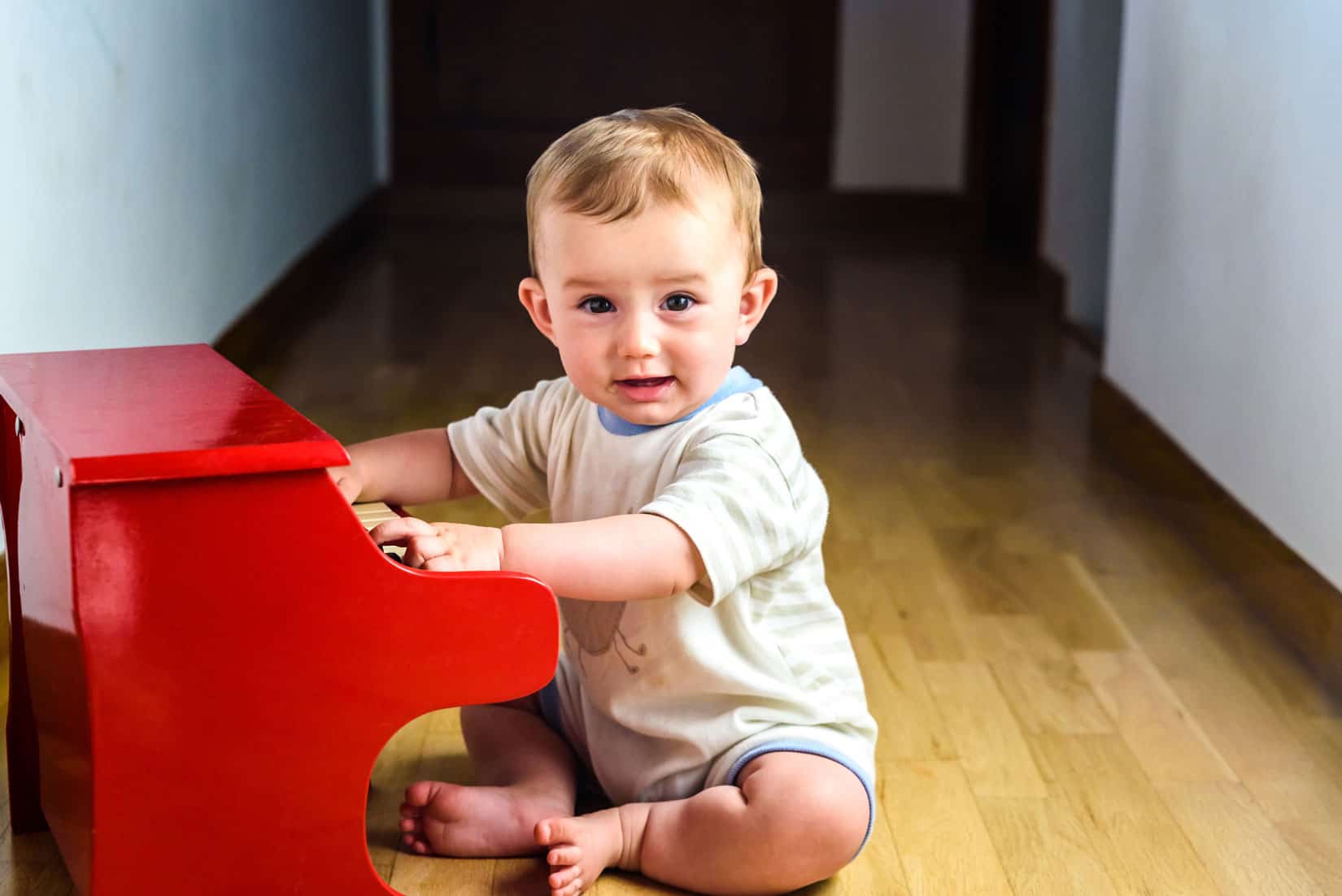 Baby playing a toy piano