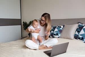 Mom showing baby to family through video chat