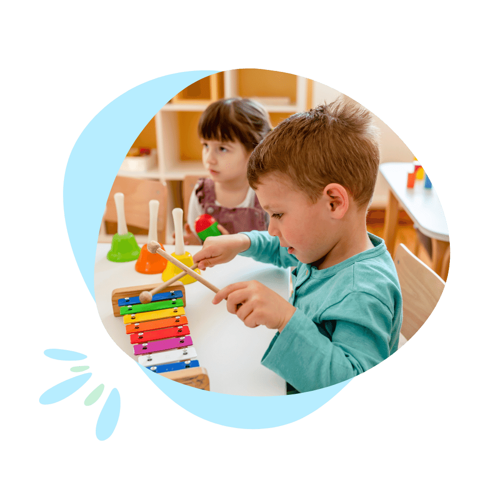 Two children engaged in joyful play with montessori toys in a classroom