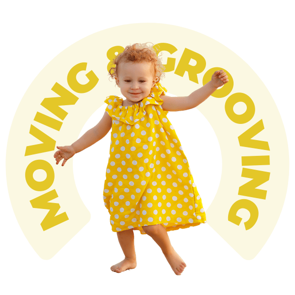 little toddler in yellow outfit dancing in front of text that reads moving & grooving