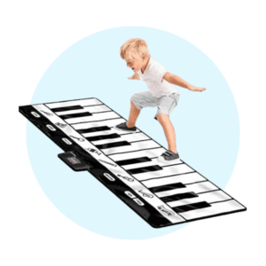 boy jumping on piano mat