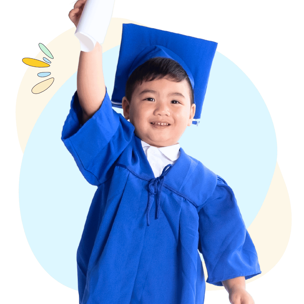 Little boy raising hand happily with graduation diploma