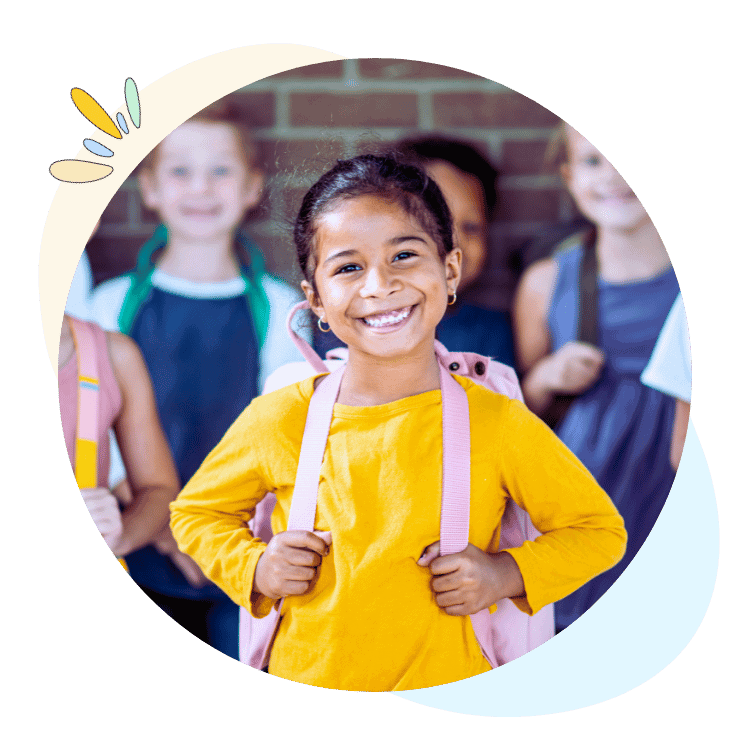 Elementary student wearing a backpack in front of her peers