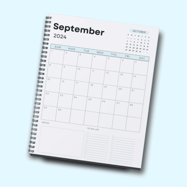 A spiral notebook open to the September planner month page