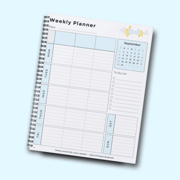 A spiral notebook open to a weekly planner page