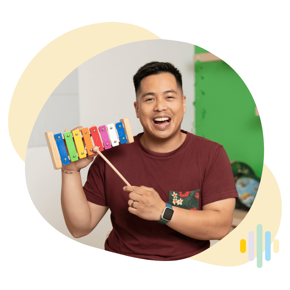 Minibop Teacher Mel holding a xylophone