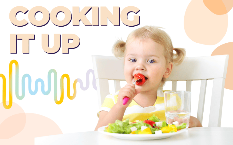 Toddler girl eating vegetables at a table